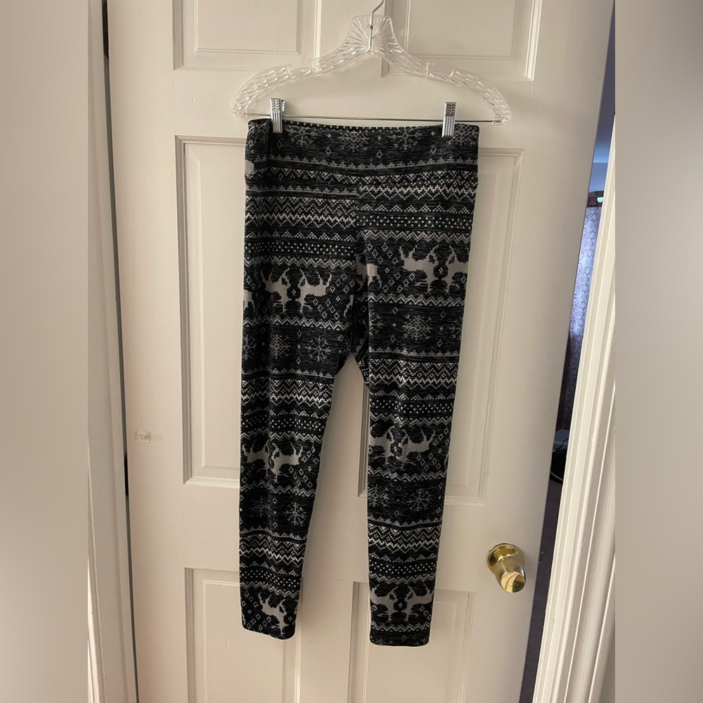 Black and white pants with a rain deer pattern. Size large.  Brand NO BO.